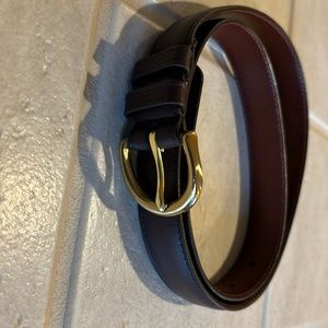 coach belt, handcrafted of natural glove, cowhide, and solid brass buckle